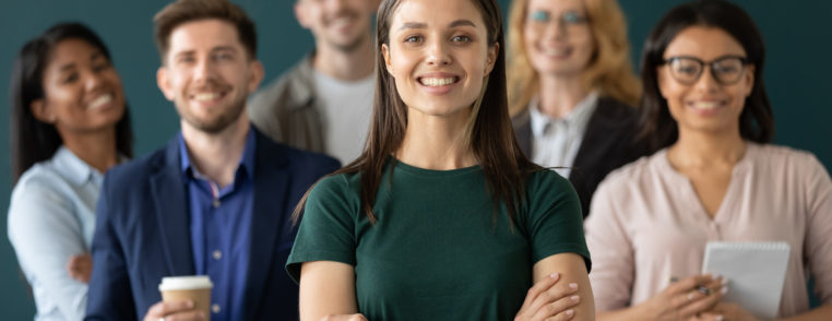 happy businesswoman hands crossed posture